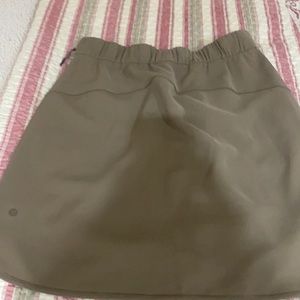 Lululemon fly skirt , wore once, brown khaki color, above knees length